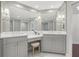 Elegant bathroom with double sinks, vanity area, custom cabinetry, and designer fixtures at 1180 Gulf Blvd # 402, Clearwater Beach, FL 33767