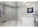Stunning bathroom with large tub and a seamless glass enclosed shower at 1180 Gulf Blvd # 402, Clearwater Beach, FL 33767