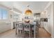 Bright kitchen featuring white cabinets, stainless steel appliances, and a center island with seating, creating cozy feel at 1180 Gulf Blvd # 402, Clearwater Beach, FL 33767