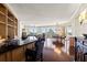 Open-concept living space with bar, dining, and living areas, showcasing hardwood floors and ocean views at 1180 Gulf Blvd # 402, Clearwater Beach, FL 33767