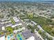A captivating aerial view of a community featuring mature trees, manicured green spaces, and diverse housing options at 11800 Park Blvd # 208, Seminole, FL 33772