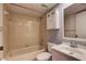 Neutral bathroom with tiled bathtub, shower, and a vanity with cabinet storage at 11800 Park Blvd # 208, Seminole, FL 33772