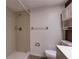 Bathroom featuring a tiled shower, vanity and tile floors at 11800 Park Blvd # 208, Seminole, FL 33772