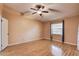Bedroom with ceiling fan, hardwood floors and natural light from the window at 11800 Park Blvd # 208, Seminole, FL 33772