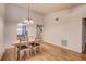 Inviting dining area with table, chairs, and a view of the adjacent kitchen at 11800 Park Blvd # 208, Seminole, FL 33772