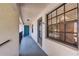 Inviting hallway featuring a bright blue door with a view of the surroundings at 11800 Park Blvd # 208, Seminole, FL 33772