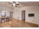 Inviting living room features a ceiling fan, hardwood floors and wall-mounted TV bracket at 11800 Park Blvd # 208, Seminole, FL 33772