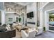 Clubhouse lounge area with comfortable seating, a cozy fireplace, and modern décor, ideal for relaxation and socializing at 11938 Royce Waterford Cir, Tampa, FL 33626