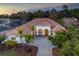 Stunning home featuring a well manicured front yard, beautiful tile roof, and paved driveway at 11938 Royce Waterford Cir, Tampa, FL 33626