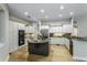 Spacious kitchen features a large island, stainless appliances, and custom cabinetry at 11938 Royce Waterford Cir, Tampa, FL 33626