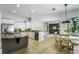 Open kitchen with stainless appliances and breakfast nook leads to living area at 11938 Royce Waterford Cir, Tampa, FL 33626
