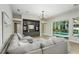 Comfortable living room with backyard pool view at 11938 Royce Waterford Cir, Tampa, FL 33626