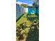 Cozy fenced backyard with a shed and lush green grass, perfect for relaxation and outdoor activities at 12176 Croft Dr, Largo, FL 33774