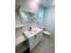 Bright bathroom featuring a modern vanity with a stylish sink and fixtures at 12176 Croft Dr, Largo, FL 33774