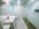 Bright bathroom featuring a modern glass shower and vanity with a stylish sink at 12176 Croft Dr, Largo, FL 33774