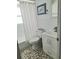 Bright bathroom featuring tiled floor, a white vanity, and updated fixtures at 12176 Croft Dr, Largo, FL 33774