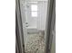 Modern bathroom featuring tile floor, white subway tile, and a shower with white curtain at 12176 Croft Dr, Largo, FL 33774