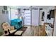 Bright Bedroom features a modern sliding barn door, crib, and stylish decor at 12176 Croft Dr, Largo, FL 33774
