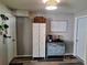 Inviting entryway with decorative cabinet, accent lighting, and coat closet at 12176 Croft Dr, Largo, FL 33774