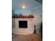 Inviting fireplace with a stone surround and a decorative mantel, perfect for cozy evenings at 12176 Croft Dr, Largo, FL 33774