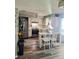 Bright kitchen features white cabinets, stainless steel appliances and a stylish breakfast bar with seating at 12176 Croft Dr, Largo, FL 33774