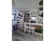 Bright kitchen features white cabinets, stainless steel appliances and a stylish breakfast bar with seating at 12176 Croft Dr, Largo, FL 33774