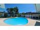 Private backyard pool with surrounding landscaping and a patio seating area at 12176 Croft Dr, Largo, FL 33774