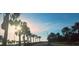 Scenic road view lined with palm trees, offering a glimpse of tropical beauty and a serene atmosphere at 12176 Croft Dr, Largo, FL 33774