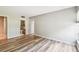 Bright bedroom features hardwood floors and en suite bathroom access at 13501 Palmwood Ln # 0, Tampa, FL 33618