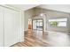 Bright living room with wood floors, vaulted ceilings, and access to the screened porch at 13501 Palmwood Ln # 0, Tampa, FL 33618