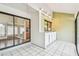 Enclosed porch with access to the kitchen, living room and backyard at 13501 Palmwood Ln # 0, Tampa, FL 33618