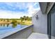 Balcony view featuring a lake and manicured golf course with palm trees at 13635 Twin Lakes Ln # 13635, Tampa, FL 33618