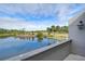 Balcony view with a lake and manicured golf course featuring palm trees at 13635 Twin Lakes Ln # 13635, Tampa, FL 33618