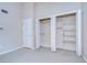 Bedroom features a large closet with bi-fold doors and a door that leads to the hallway at 13635 Twin Lakes Ln # 13635, Tampa, FL 33618