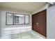 Charming front entryway with a decorative solid wood door, tiled floor, and natural light at 13635 Twin Lakes Ln # 13635, Tampa, FL 33618