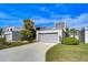 Beautiful townhome with an attached garage, landscaped yard, and a well maintained driveway at 13635 Twin Lakes Ln # 13635, Tampa, FL 33618