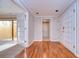 Inviting foyer with pristine hardwood floors, offering seamless access to various living areas at 13635 Twin Lakes Ln # 13635, Tampa, FL 33618