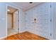 Elegant foyer featuring gorgeous hardwood floors, a coat closet, and white doors at 13635 Twin Lakes Ln # 13635, Tampa, FL 33618