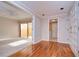 Bright foyer with hardwood floors and seamless transitions to the bathroom, living, and outdoor spaces at 13635 Twin Lakes Ln # 13635, Tampa, FL 33618