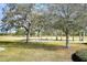 View of the golf course through the trees at 13635 Twin Lakes Ln # 13635, Tampa, FL 33618