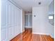 Hallway features wood floors, access to upper level and doors leading to other rooms in the home at 13635 Twin Lakes Ln # 13635, Tampa, FL 33618