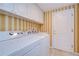 Laundry room featuring white washer and dryer, cabinets, and door at 13635 Twin Lakes Ln # 13635, Tampa, FL 33618