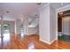 Open-concept living area with hardwood floors and plenty of natural light at 13635 Twin Lakes Ln # 13635, Tampa, FL 33618