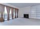 Living room features a fireplace, built-in shelves and sliding glass doors to a balcony at 13635 Twin Lakes Ln # 13635, Tampa, FL 33618