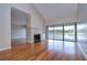 Bright living room with fireplace and sliding glass doors to the deck with scenic views at 13635 Twin Lakes Ln # 13635, Tampa, FL 33618