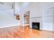 Cozy living room area with a fireplace and view of the staircase at 13635 Twin Lakes Ln # 13635, Tampa, FL 33618