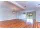 Bright living area with hardwood floors, architectural columns and sliding glass doors at 13635 Twin Lakes Ln # 13635, Tampa, FL 33618