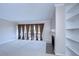Living room features a fireplace, built-in shelves and sliding glass doors to a balcony at 13635 Twin Lakes Ln # 13635, Tampa, FL 33618