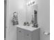 Contemporary bathroom featuring a gray vanity, updated fixtures, and neutral color scheme at 1406 Valley Pl, Brandon, FL 33510