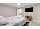 This bedroom features a tv, a small stand, and a comfortable bed with a Paris-themed comforter at 1406 Valley Pl, Brandon, FL 33510
